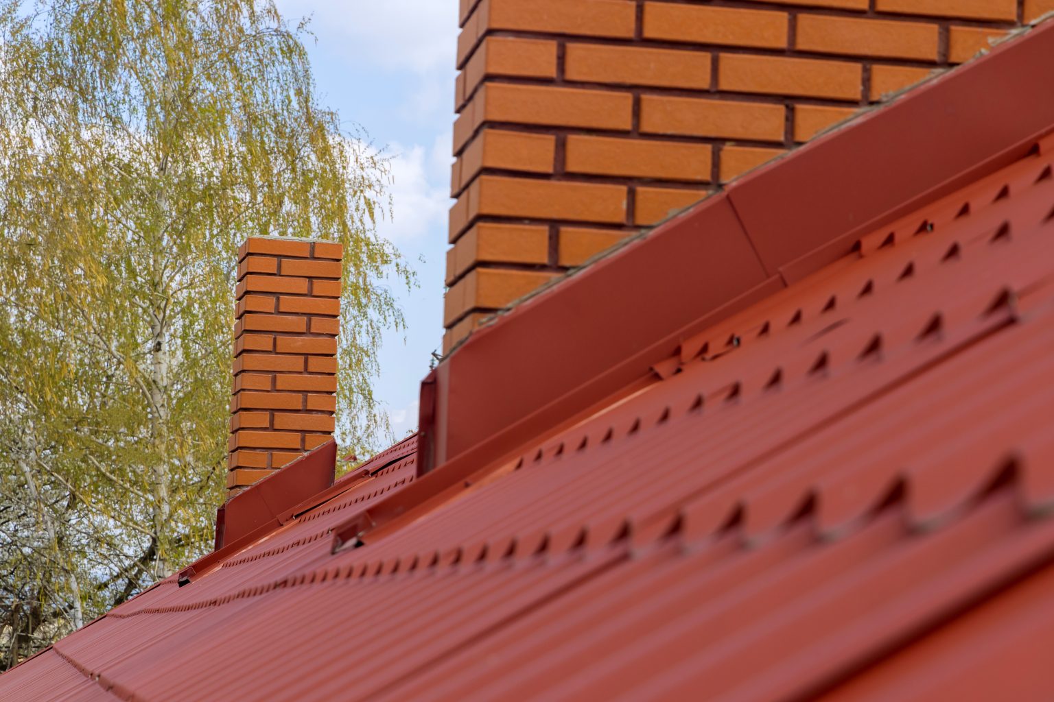 Red tiled rooftop restored by Home Roof Restorations